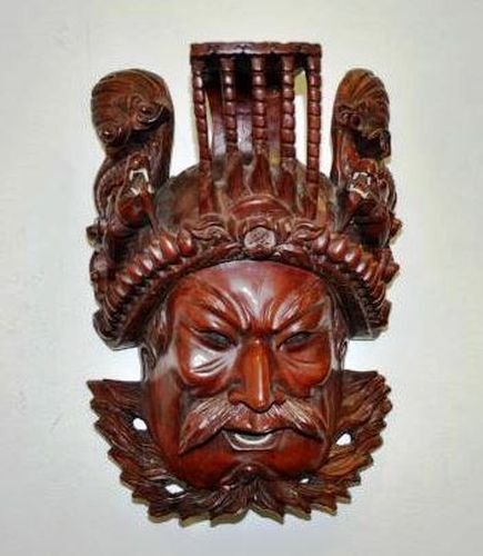 CHINESE ROSEWOOD HAND CARVED MASK: EXTRAORDINARY CHINESE ROSEWOOD HAND CARVED GENERAL GUANG YU MASK WALL DECORATIVE CARVING ART PIECE WITH A DETAILED DEPICTION OF DRAGONS ON TOP. BONE IS USED AS THE MAN'S AND DRAGONS' TEETH. THIS PIECE
