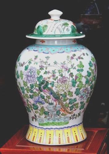 CHINESE PORCELAIN GINGER JAR WITH COVER: VERY FINE CHINESE PORCELAIN GINGER JAR WITH COVER, THE HAND PAINTED DETAILS DEPICT GORGEOUS PEACOCKS, PEONY AND LOTUS FLOWERS. MARKINGS ON BOTTOM. IT MEASURES APPROX. 17 INCHES TALL AND 10 INCHES WIDE