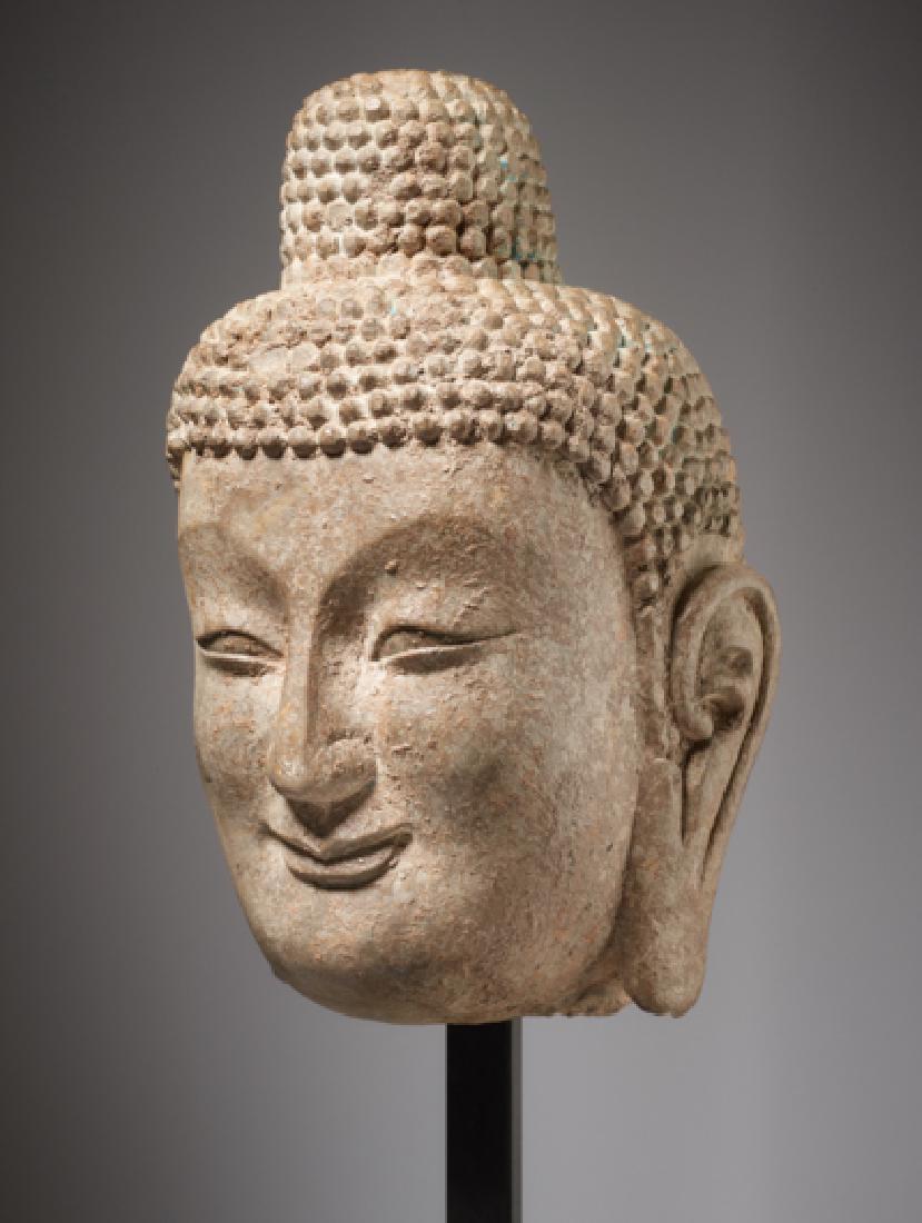 LARGE HEAD OF A SMILING BUDDHA (1 of 3)