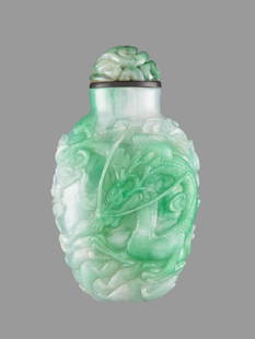 AN EMERALD GREEN JADEITE 'DRAGON' SNUFF BOTTLE: AN EMERALD GREEN JADEITE 'DRAGON' SNUFF BOTTLE, QING DYNASTY Lustrous semi-translucent jadeite of emerald green color with areas of silvery white, smooth 'oily' finish. China, 19th century Centered de