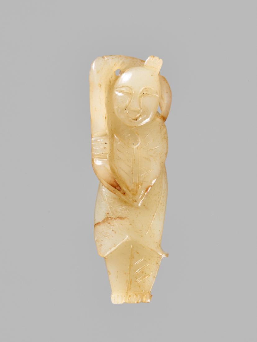 A CELADON JADE 'PLAYING BOY' PENDANT, LATE MING DYNASTY (1 of 4)