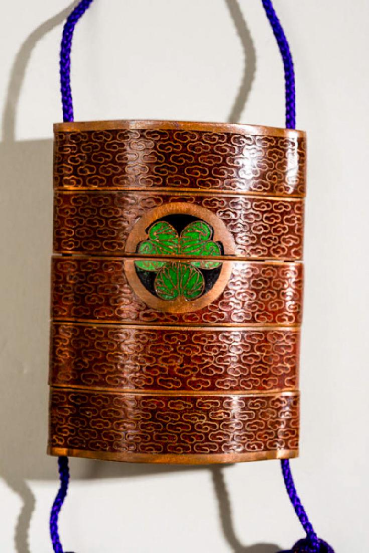 INRO WITH CLOISONE AND AOI-MON: Metal allow, enamel and gold. Japan, 19th cent. Rare, four-story inro made of a copper alloy which possibly includes gold, as suggested by the piece's weight as well as shine. The exterior is coated i