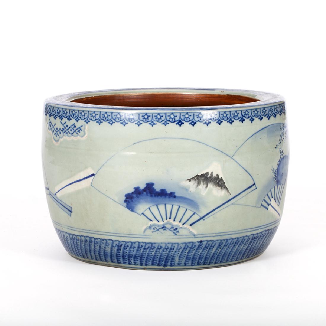 WHITE AND BLUE PORCELAIN HIBACHI WITH FUJI MOTIF: Porcelain, colored in blue. Japan, Meiji Period This so-called hibachi (Jap. 'fire bowl') is a traditional Japanese heating device designed to hold burning charcoal. It features a beautiful decor in b