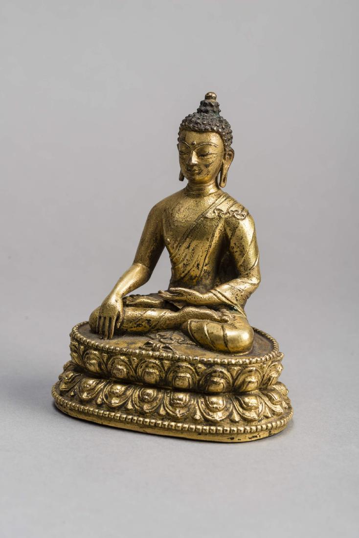 A GILT BRONZE FIGURE OF BUDDHA AKSHOBYA, 17TH-18TH (1 of 5)
