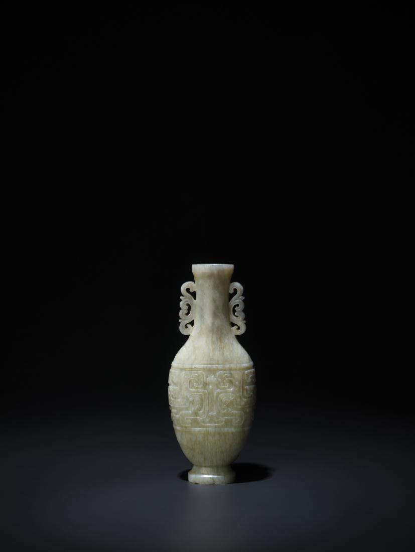 A SMALL ARCHAISTIC MOTTLED WHITE JADE VASE, 17-18c. (1 of 7)