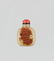 A YELLOW AND RUSSET JADE 'BUDDHIST LION' SNUFF BOTTLE