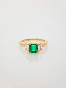 AN IMPORTANT CARTIER EMERALD AND DIAMOND RING: AN IMPORTANT CARTIER EMERALD AND DIAMOND RING France, ca. 1990, signed 'Cartier', assay '750', numbers '639389' and '54' Accompanied by original makers case, original Cartier certificate of