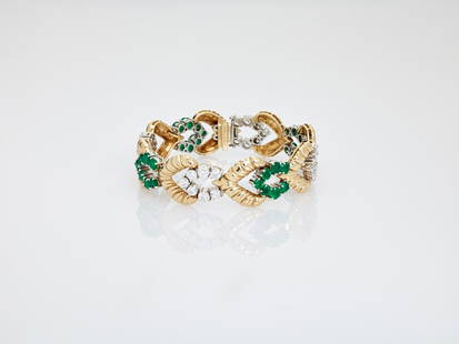 VAN CLEEF & ARPELS GOLD BRACELET EMERALDS & DIAMONDS: A VAN CLEEF & ARPELS GOLD BRACELET WITH 11 CARATS OF EMERALDS AND DIAMONDS New York, ca. 1940, signed 'V. C. A. N. Y.' on the clasp Bearing a standard 'Double Safety' locking mechanism at the backside