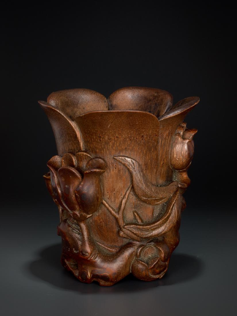 A CARVED KANGXI PERIOD BAMBOO 'MAGNOLIA' LIBATION CUP (1 of 7)