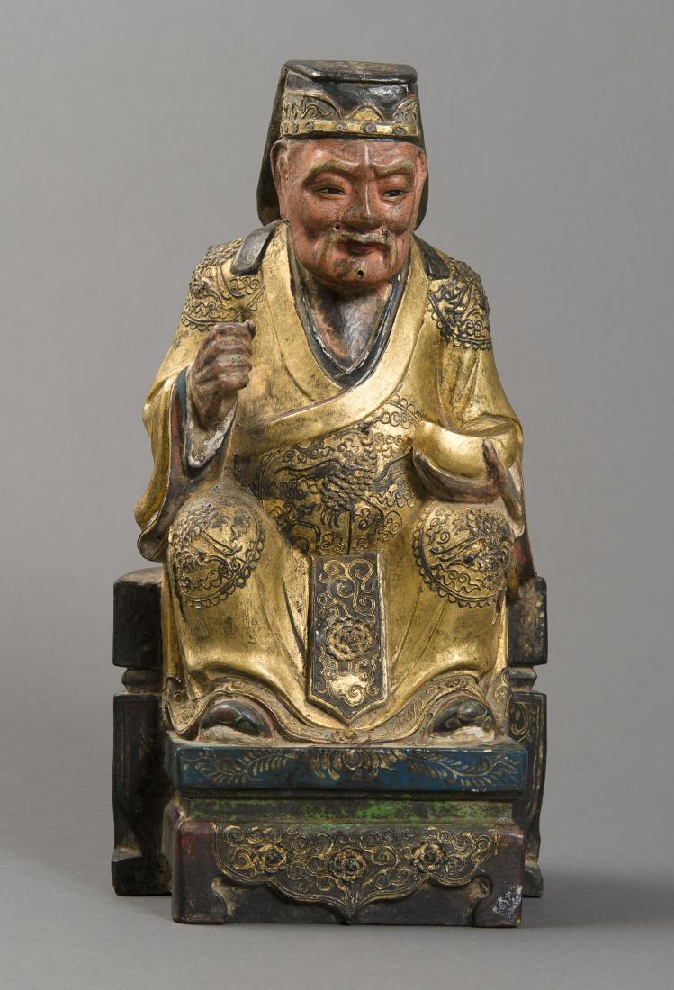 IMPERIAL DIGNITARY ON A THRONE: IMPERIAL DIGNITARY ON A THRONE Wood with gilding China, Qing-dynasty (1644-1911) Tiered throne with floral decoration, golden robe with fine plaster decoration, in which multiple fenghuan (phoenixes)