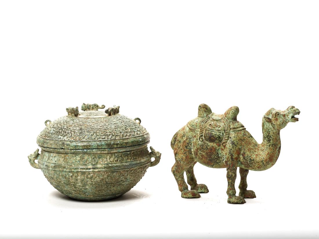 A TANG-STYLE BRONZE CAMEL AND A WARRING STATES VESSSEL: A TANG-STYLE BRONZE CAMEL AND A WARRING STATES BRONZE VESSSEL WITH COVER Bronze China, style of Tang dynasty (618-907); Eastern Zhou, Warring States period (475-221 BC) A mixed lot of two fine Chinese