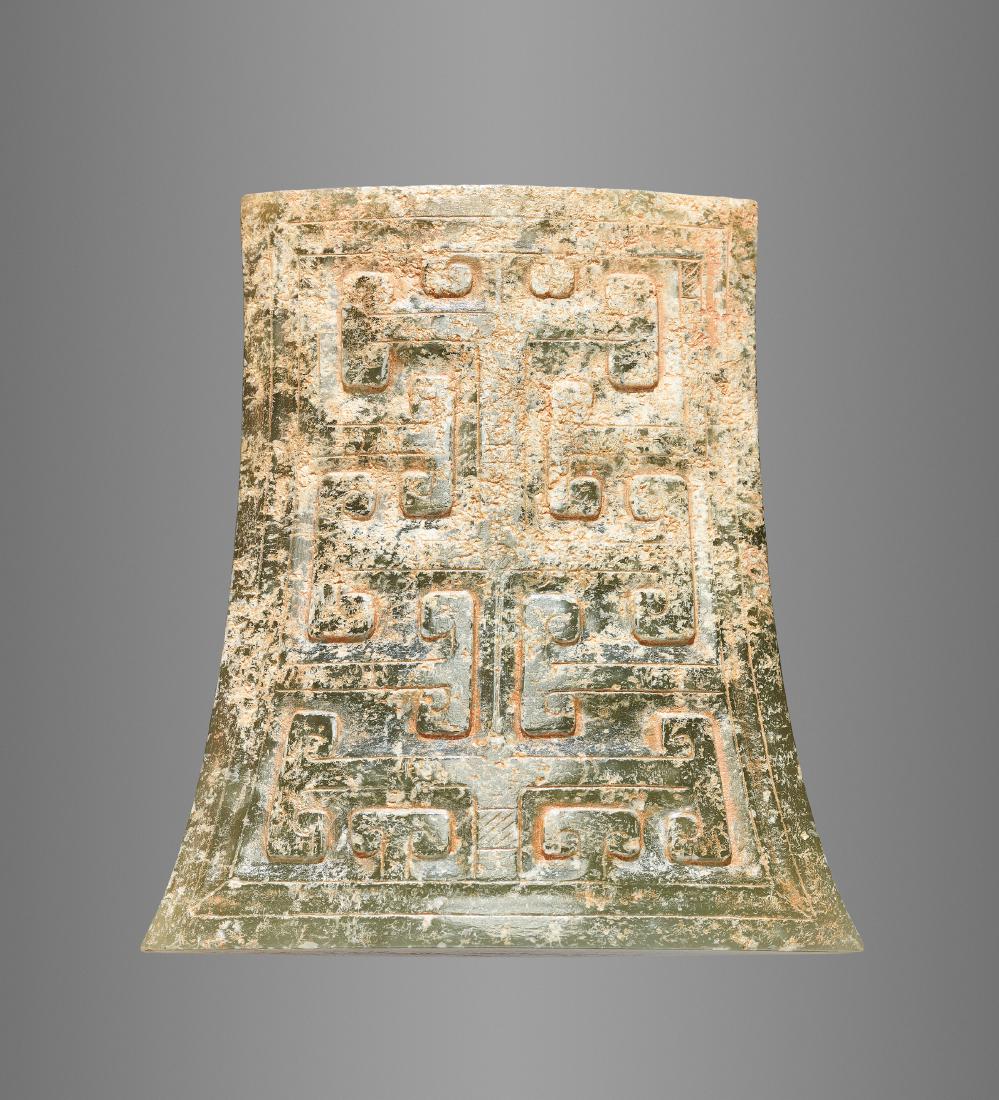 DARK GREEN JADE SCABBARD CHAPE WITH A GEOMETRIC DESIGN: A STRIKING DARK GREEN JADE SCABBARD CHAPE WITH A GEOMETRIC DESIGN Jade China, Western Han Dynasty, 3rd - 2nd century BC This scabbard chape has a slender profile and an elliptical crosssection: the cu