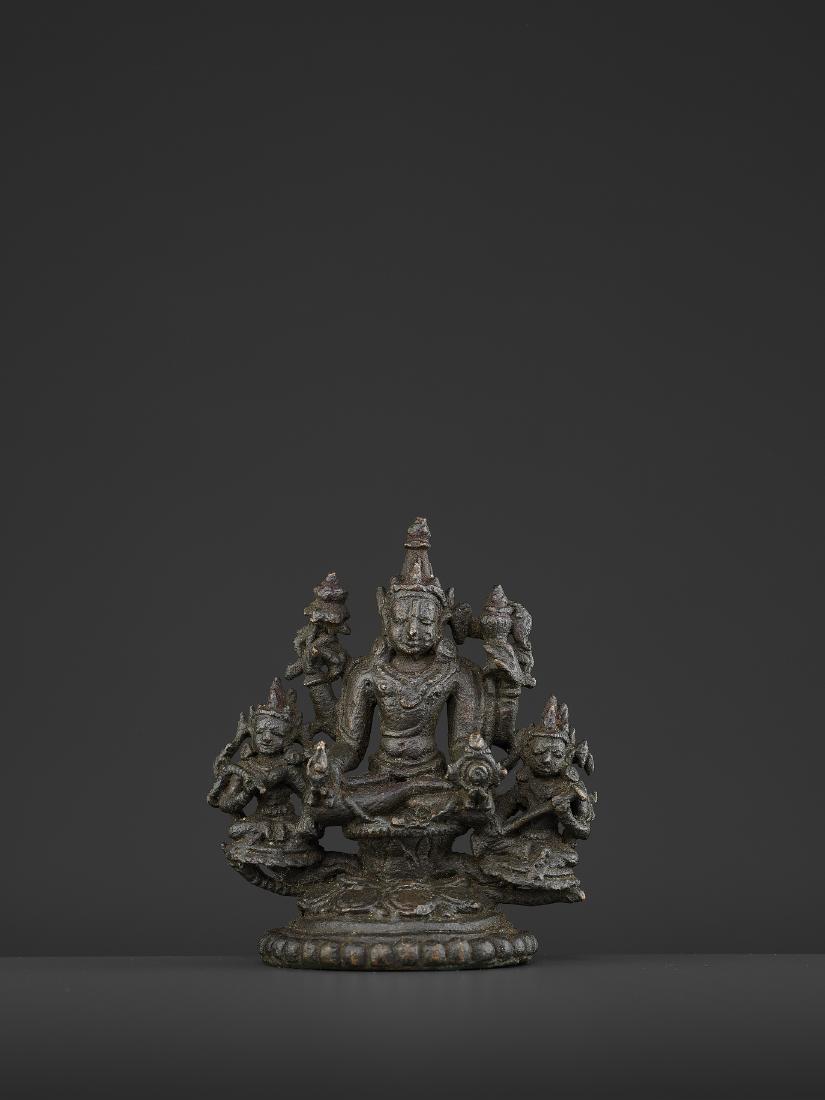 A PALA-SENA BRONZE VISHNU TRIAD: A PALA-SENA BRONZE VISHNU TRIAD Bangladesh, 11th - 12th century. Neatly cast and incised copper alloy statue with rich dark patina. Provenance: From the private collection of Thomas Chen, Taiwan. Ther