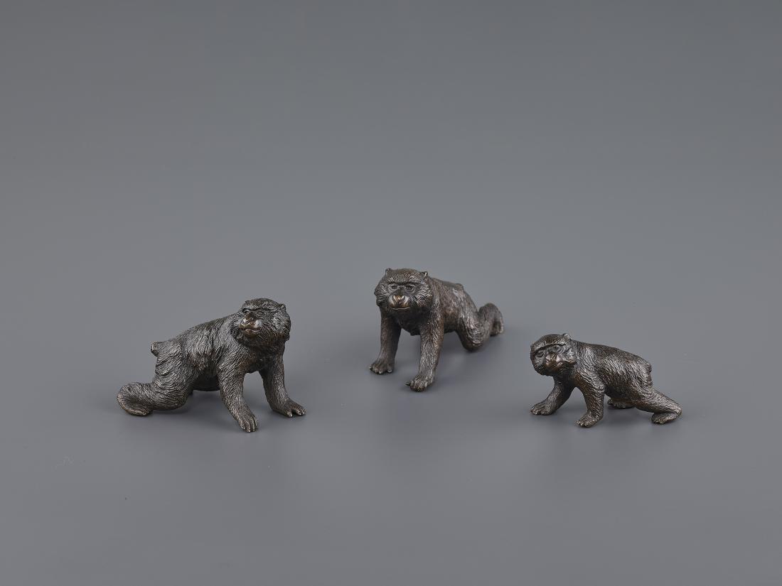 A SEIYA BRONZE GROUP OF MACAQUES: A SEIYA BRONZE GROUP OF MACAQUES Japan, Meiji period (1868-1912). All three monkeys bearing the artist signature SEIYA of the famous bronze animalist Genryusai Seiya, carved into their bellies. Highly