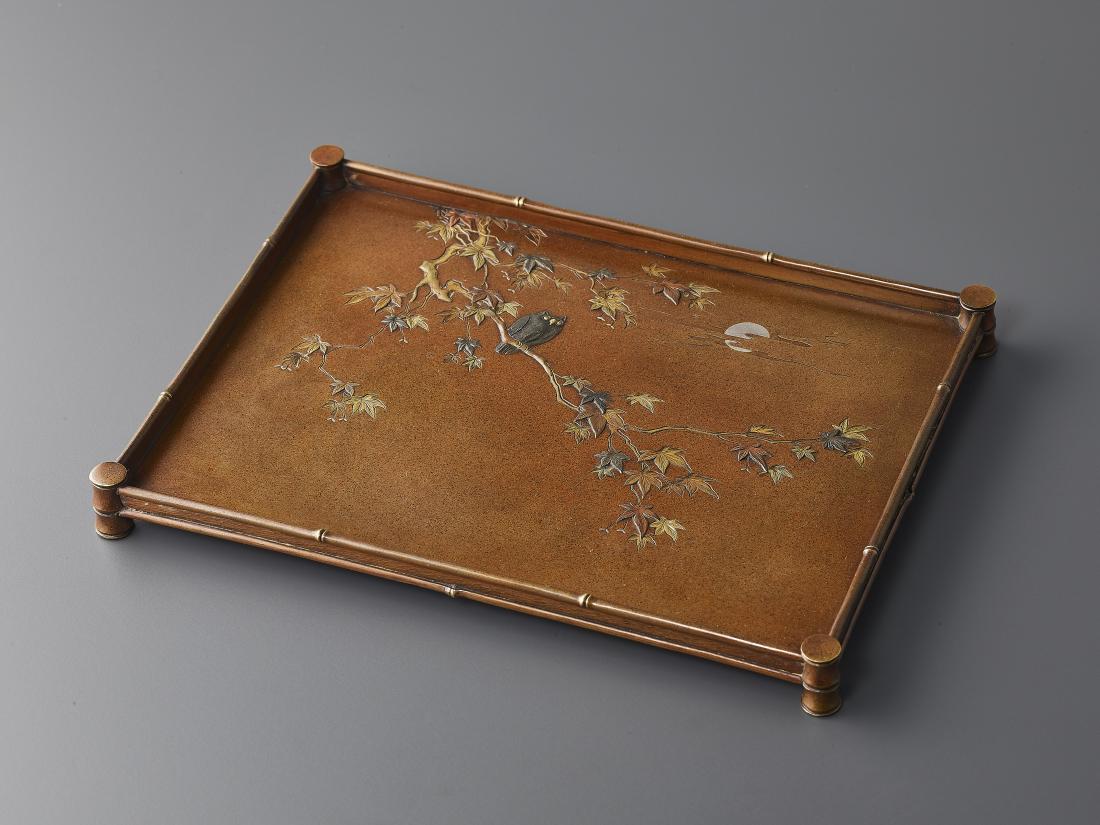 A RARE NOGAWA BRONZE TRAY: A RARE NOGAWA BRONZE TRAY Japan, Meiji period (1868-1912). Attributed to Miyabe Atsuyoshi. The rectangular tray set on four bamboo-shaped feet and decorated with an owl sitting on the branch of a mapl