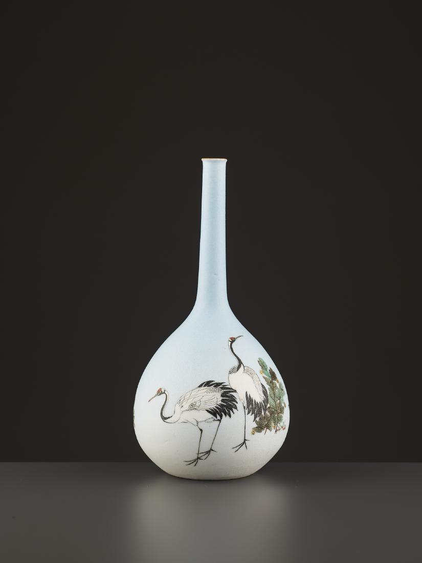 A TAKEUCHI CHUBEI BOTTLE VASE: A TAKEUCHI CHUBEI BOTTLE VASE Japan, Meiji period (1868-1912). Porcelain with a shark skin glaze and fine hand painted enamels. Depicting three red-crowned cranes and pine, both symbols of longevity.