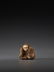 AN INLAID WOOD NETSUKE OF A KABUKI ACTOR BY HOEI