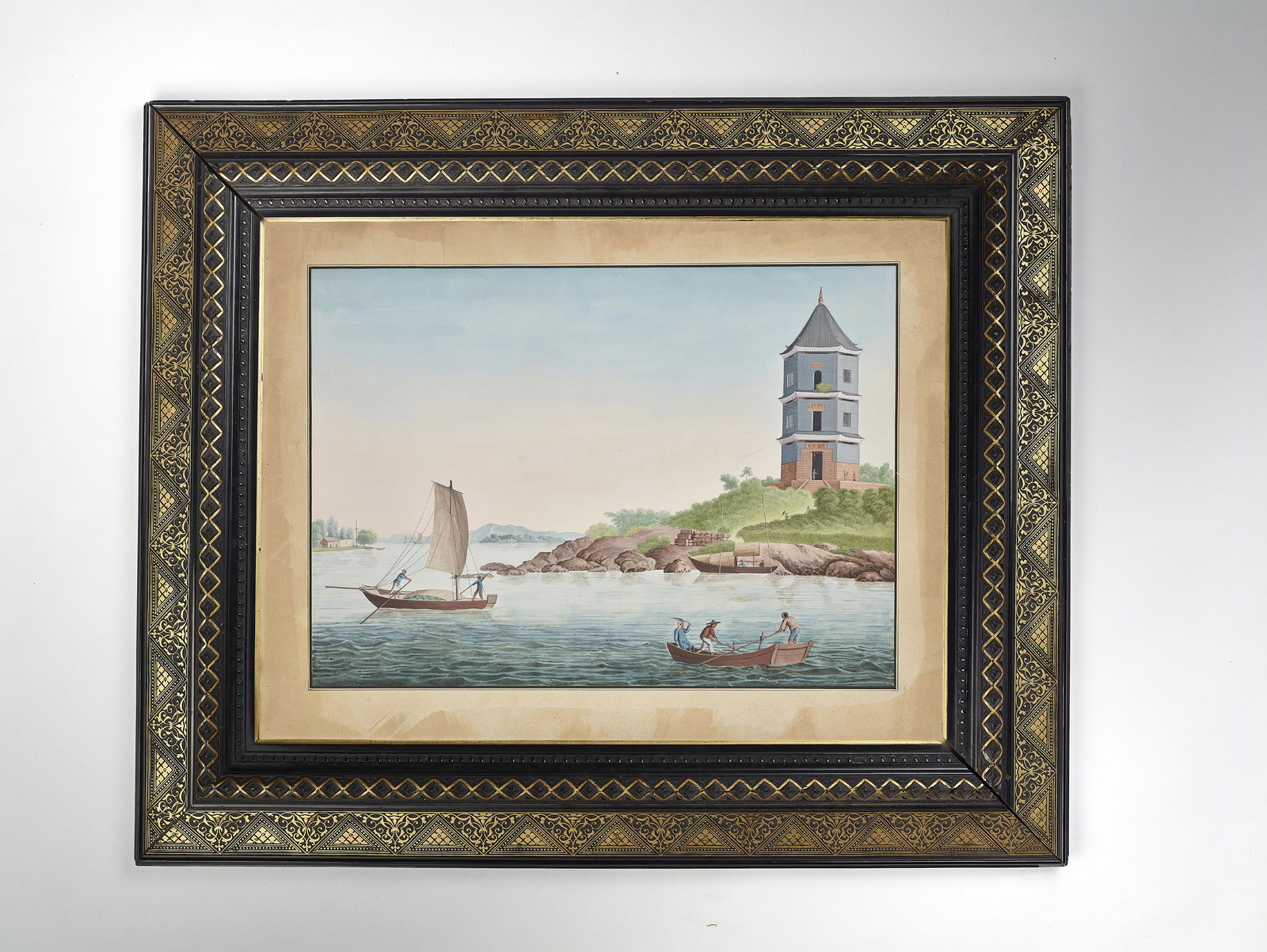 A CHINA TRADE WATERCOLOR, QING: A CHINA TRADE WATERCOLOR, QING China, 18th-19th century. Finely painted in watercolors and ink on paper to depict people in boats on a river shore with a pagoda on the far right. Good European gold an