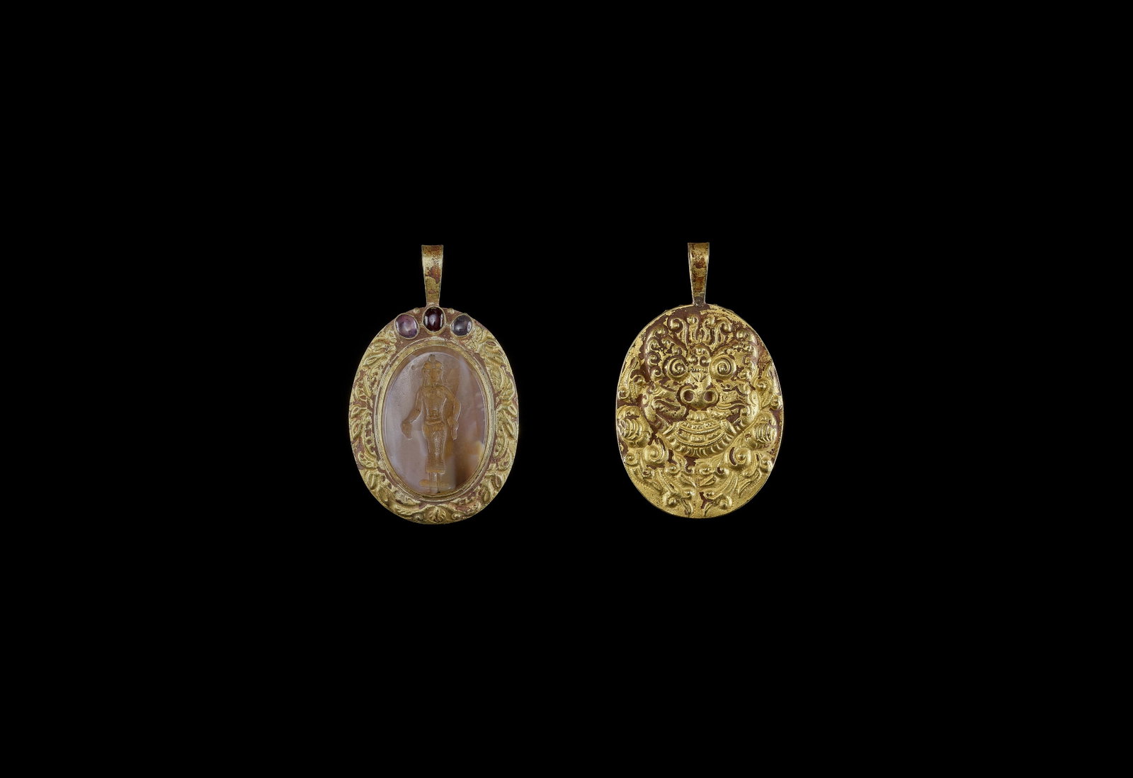 A CHAM REPOUSSE GOLD PENDANT WITH STONE INTAGLIO: A CHAM REPOUSSE GOLD PENDANT WITH STONE INTAGLIO DEPICTING A HINDU DEITY Central or southern Cham kingdom, classical period, 10th - 12th century. The intaglio dates to the late 19th or early 20th cent