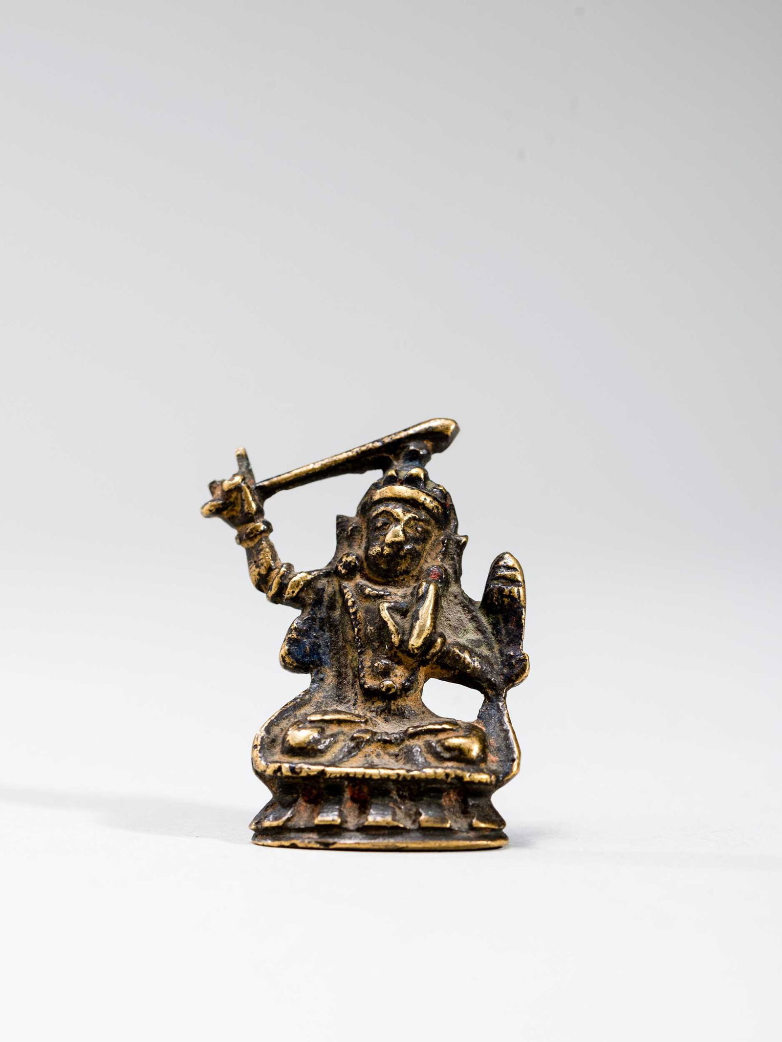 A TIBETAN MINIATURE BRONZE OF MANJUSHRI (1 of 6)