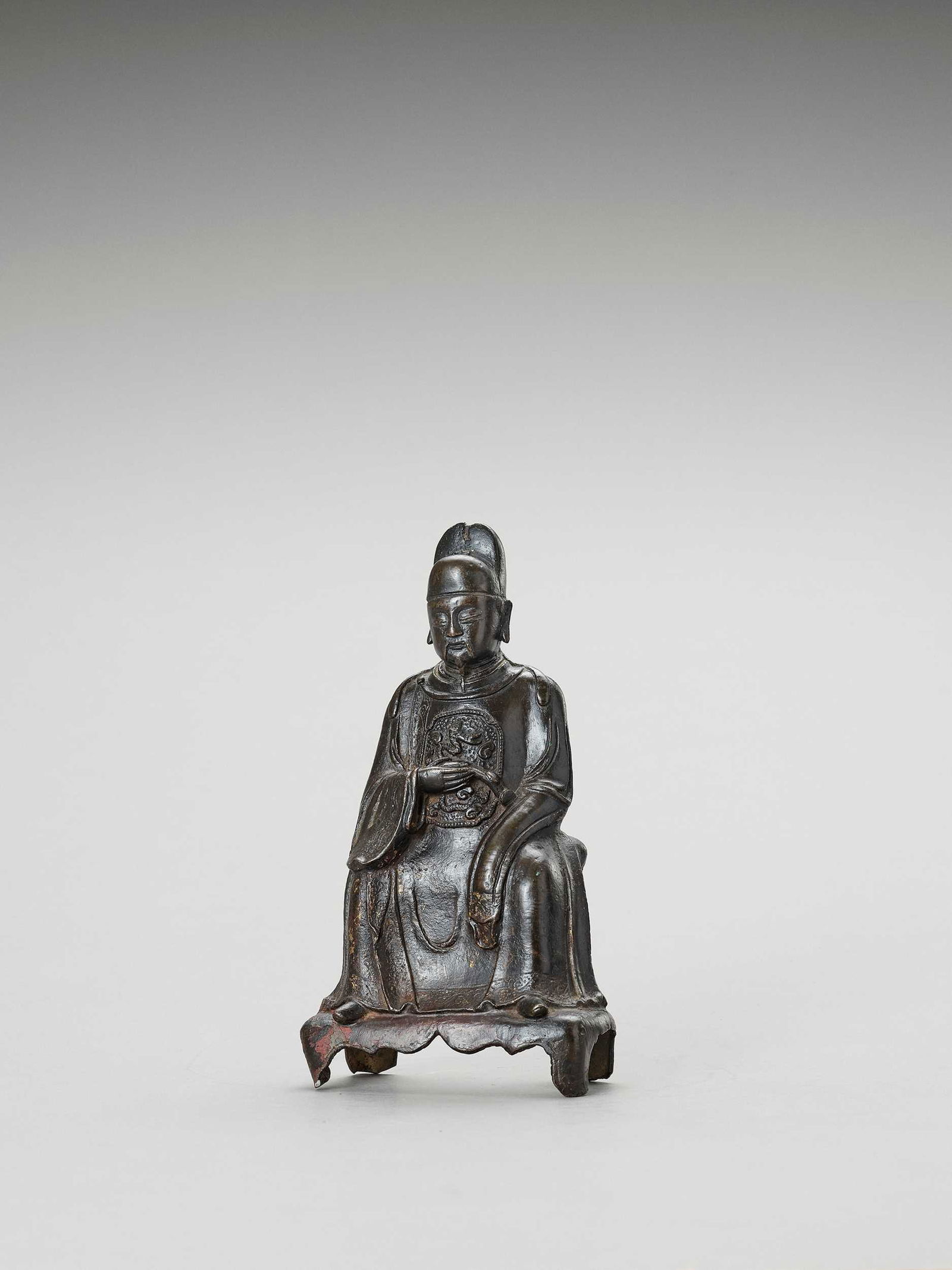 A BRONZE FIGURE OF A DAOIST SCHOLAR-OFFICIAL, MING (1 of 6)