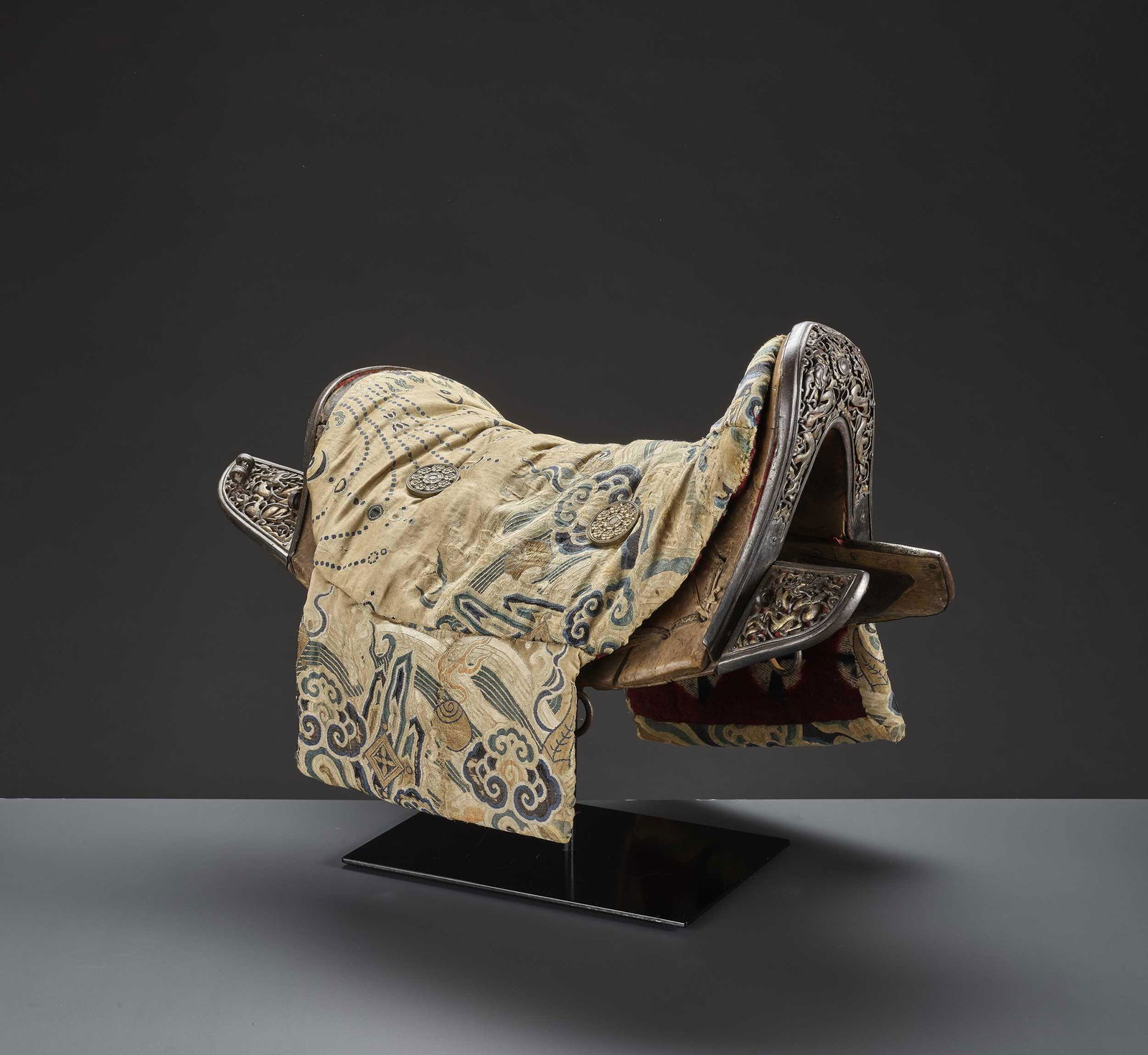 A WOOD SADDLE WITH GILT IRON FITTINGS AND SILK COVER (1 of 18)