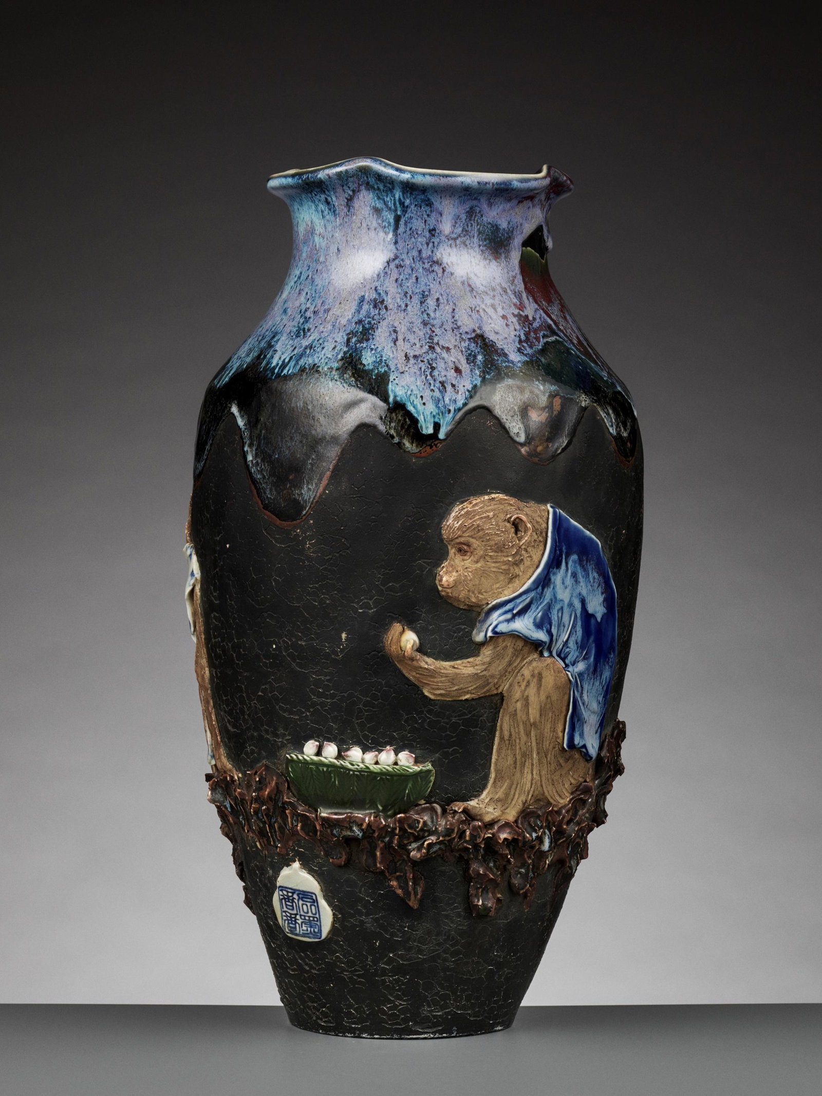 A MEIJI PERIOD BALUSTER VASE BY ISHIGURO KOKO: A MEIJI PERIOD ‘MONKEYS AND PEACHES’ BALUSTER VASE BY ISHIGURO KOKO Japan, Meiji period (1868-1912). Molded, carved and incised to one side with three monkeys, two of them wearing short-sleeved sh