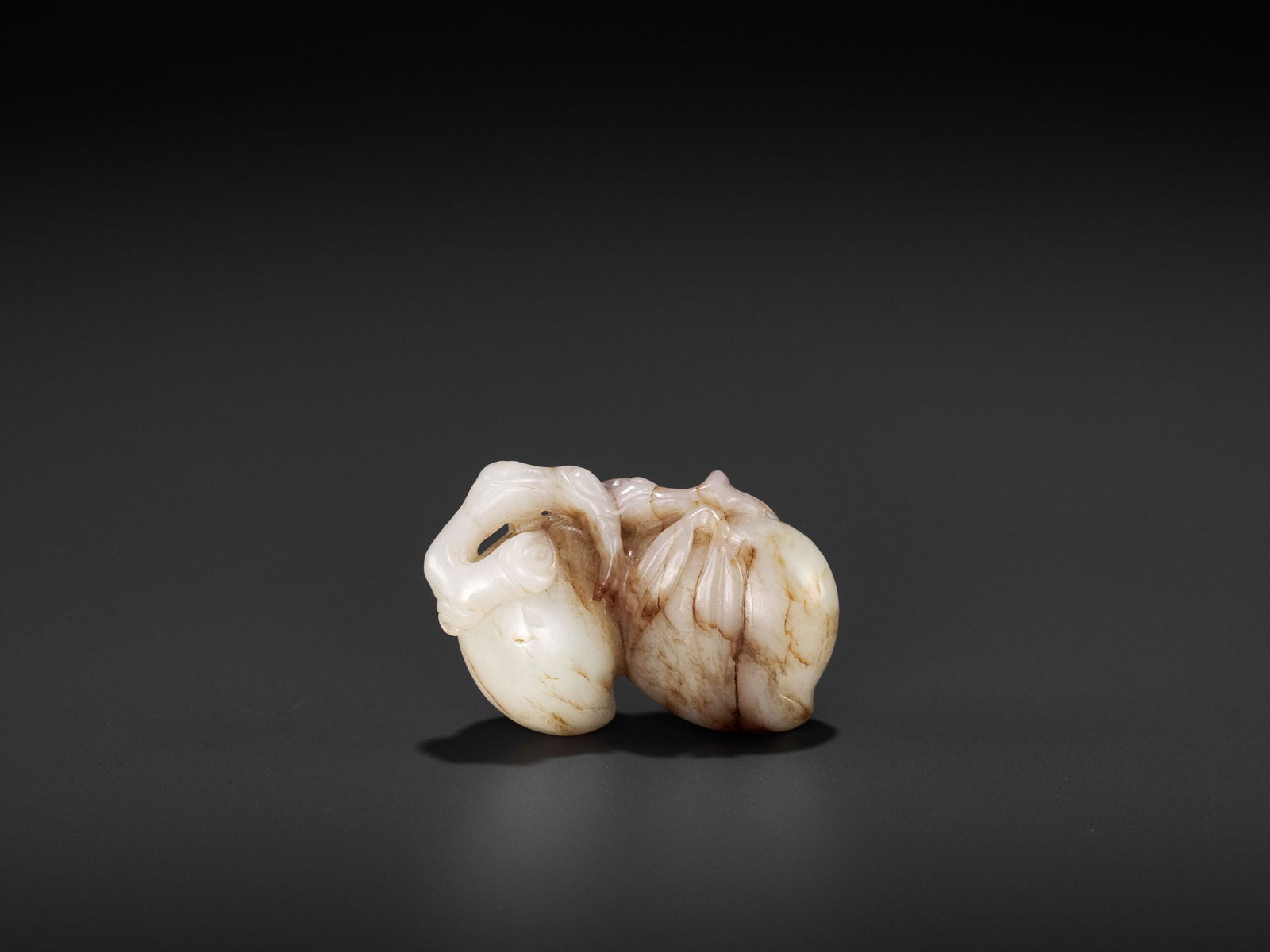 A 'DOUBLE PEACH' JADE PENDANT, MING DYNASTY (1 of 9)
