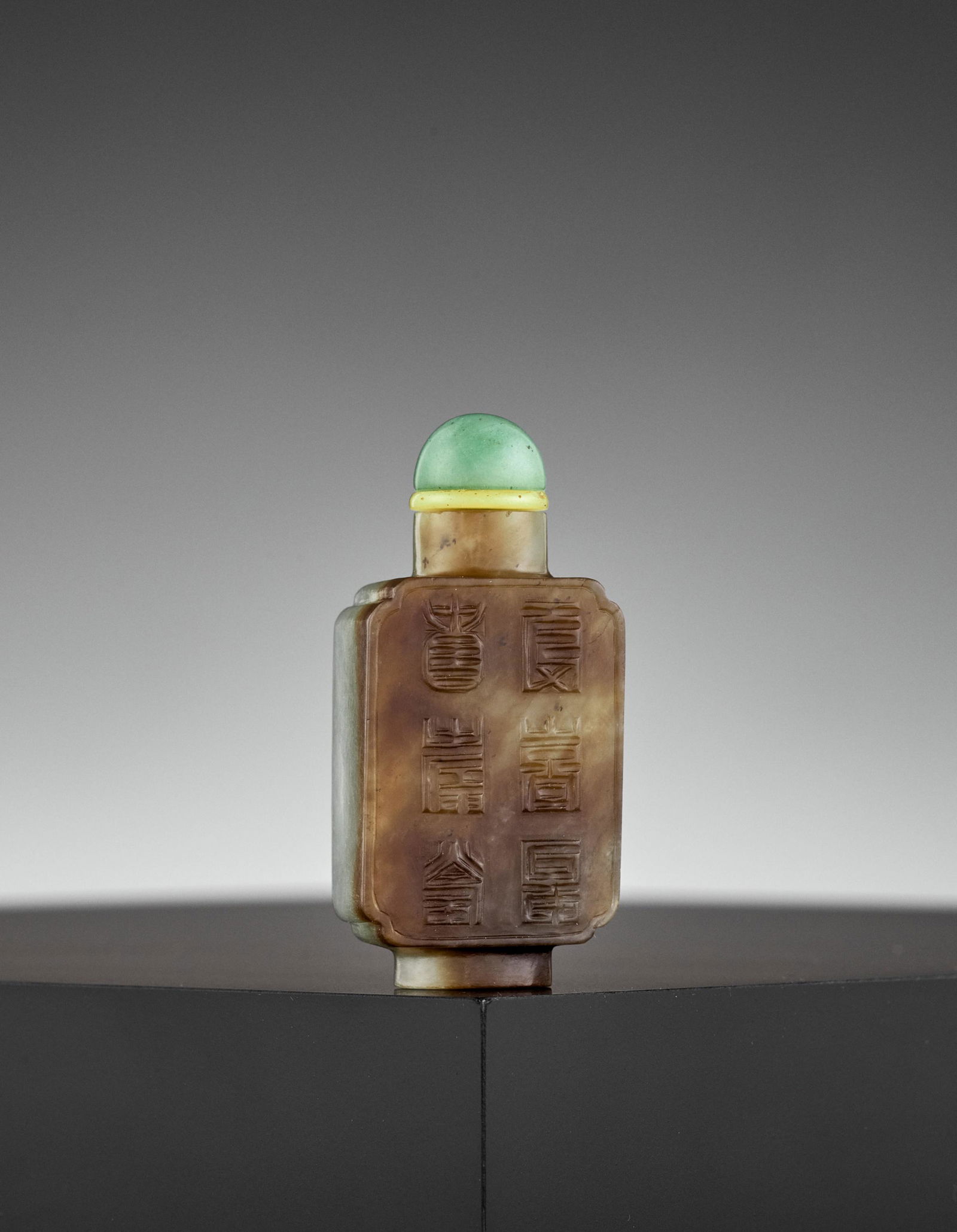 AN INSCRIBED BROWN JADE SNUFF BOTTLE, MID-QING (1 of 9)