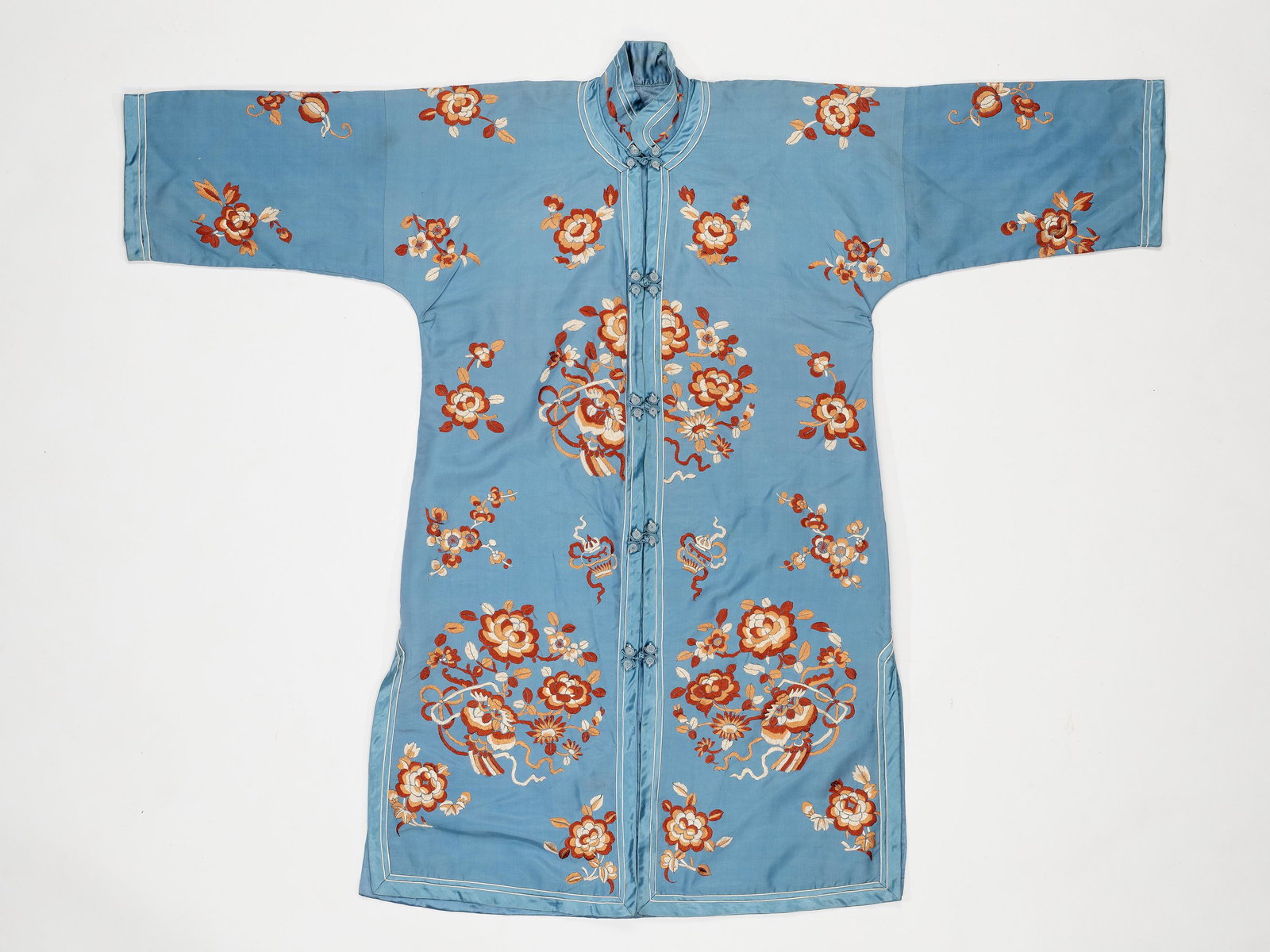 A SKY-BLUE EMBROIDERED 'SATIN STITCH' SILK LADY'S ROBE: A SKY-BLUE EMBROIDERED 'SATIN STITCH' SILK LADY'S ROBE, 1920s China, 1920s The sky-blue silk robe finely embroidered with flowers. Condition: Very good condition with hardly any wear. Prove