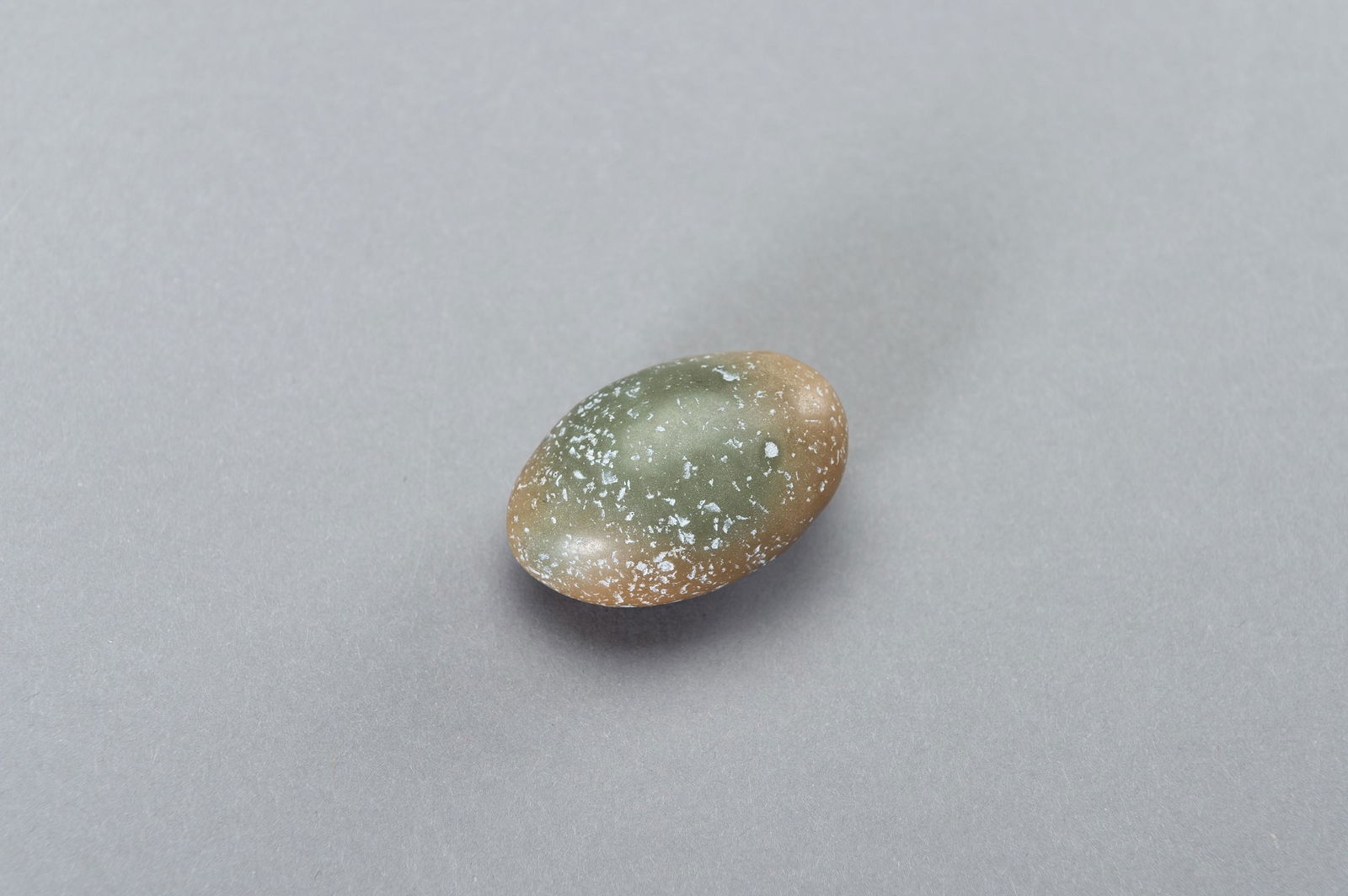 A SMALL MOONSHINE STONE 'EGG' GLOWING IN THE DARK (1 of 9)