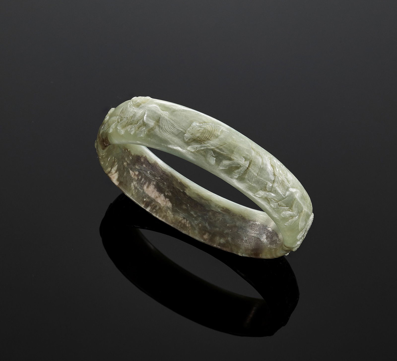 A CELADON JADE BANGLE, QING DYNASTY (1 of 10)