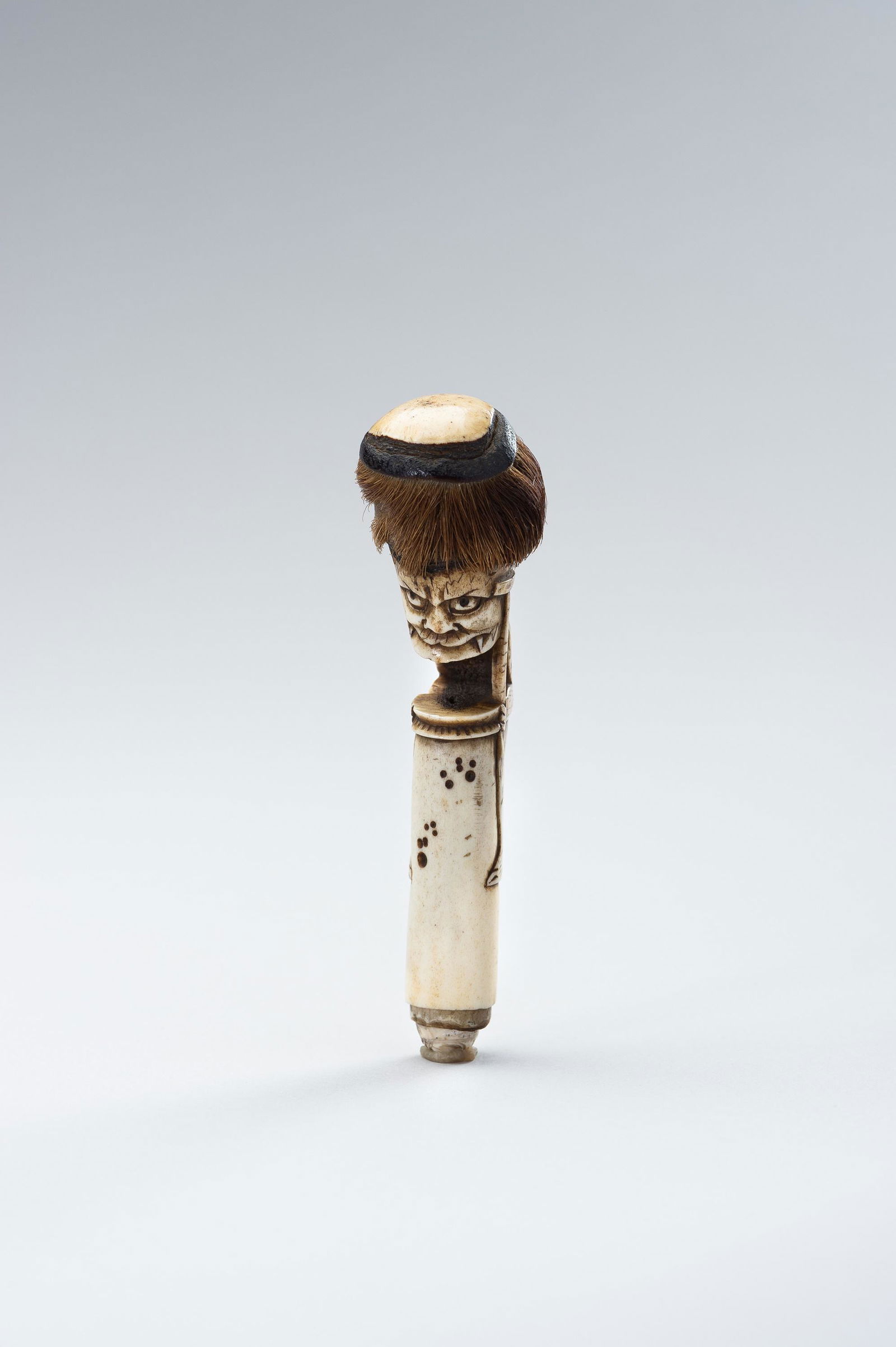 A STAG ANTLER CANE HANDLE OF AN ONI (1 of 11)