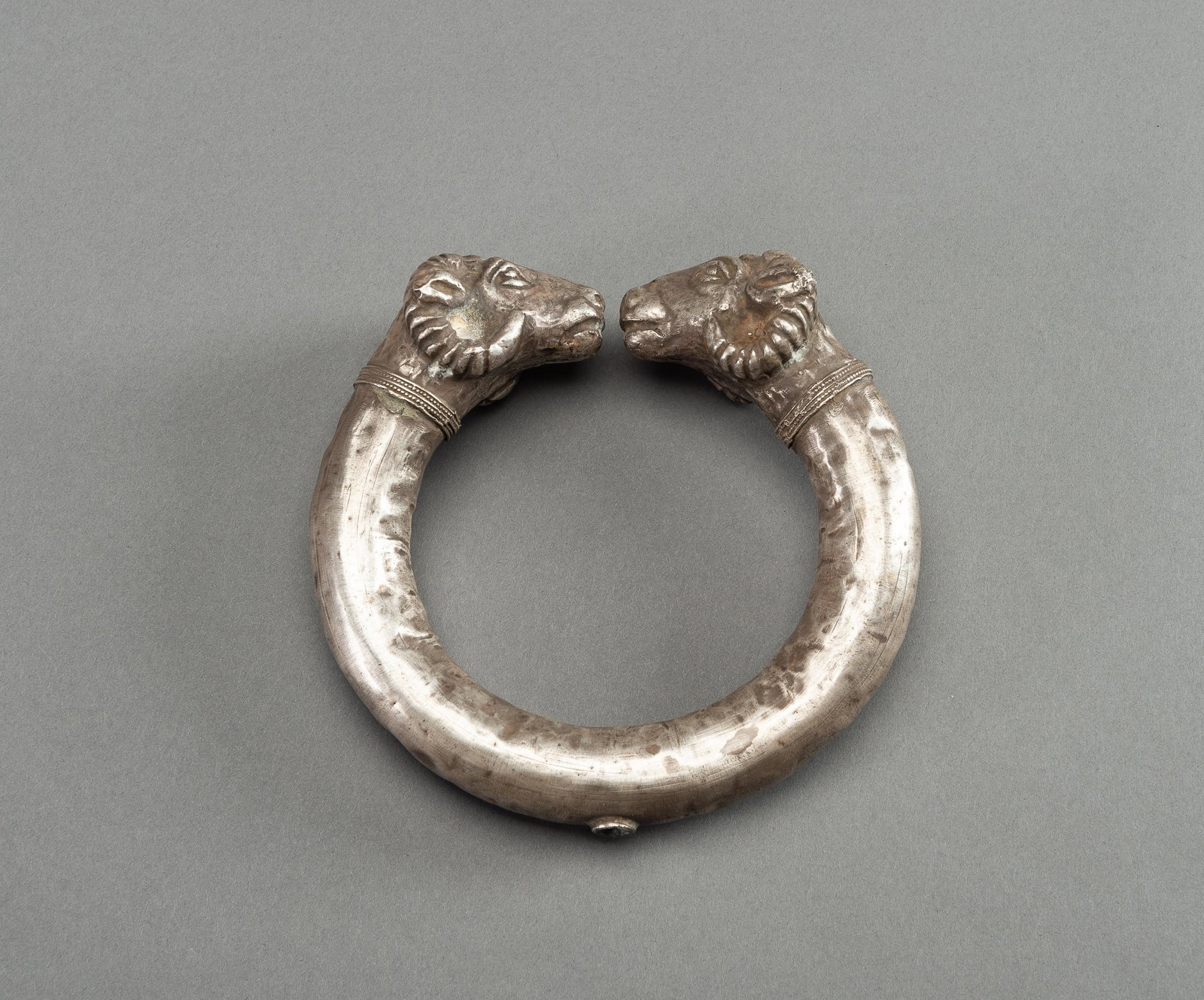 AN ACHAEMENID SILVER RAM-HEADED BRACELET (1 of 10)
