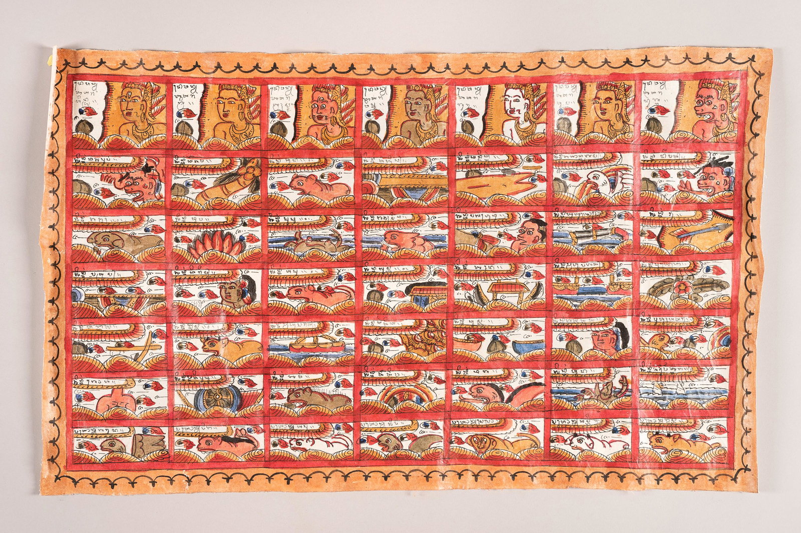 A HAND PAINTED ASTROLOGICAL CHART (PLINTANGAN): A HAND PAINTED ASTROLOGICAL CHART (PLINTANGAN) Indonesia, Bali, 20th century. Distemper on cloth. Hand painted, predominantly in red and yellow, with 49 small panels enclosing deities, animals and sym