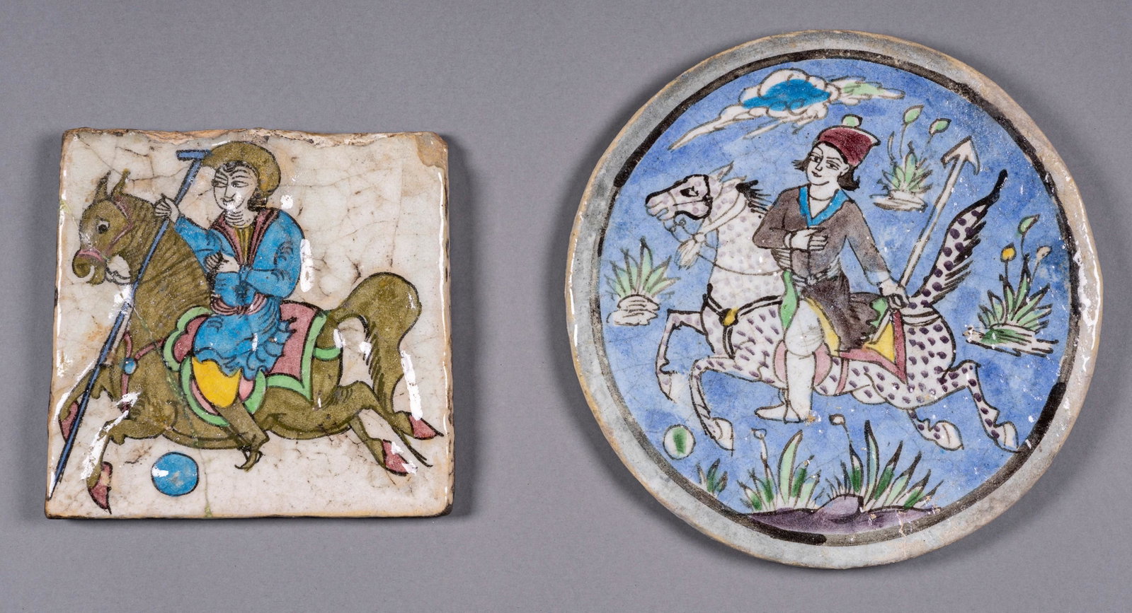 A LOT WITH TWO PERSIAN TILES WITH POLO PLAYERS: A LOT WITH TWO PERSIAN TILES WITH POLO PLAYERS Persia, first half of the 20th century. One of a square form and the other of a round shape, the glaze suffused with crackles, decorated in polychrome pa
