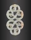 AN ARCHAISTIC PALE CELADON JADE 'COILED CHILONG' PENDANT, QING