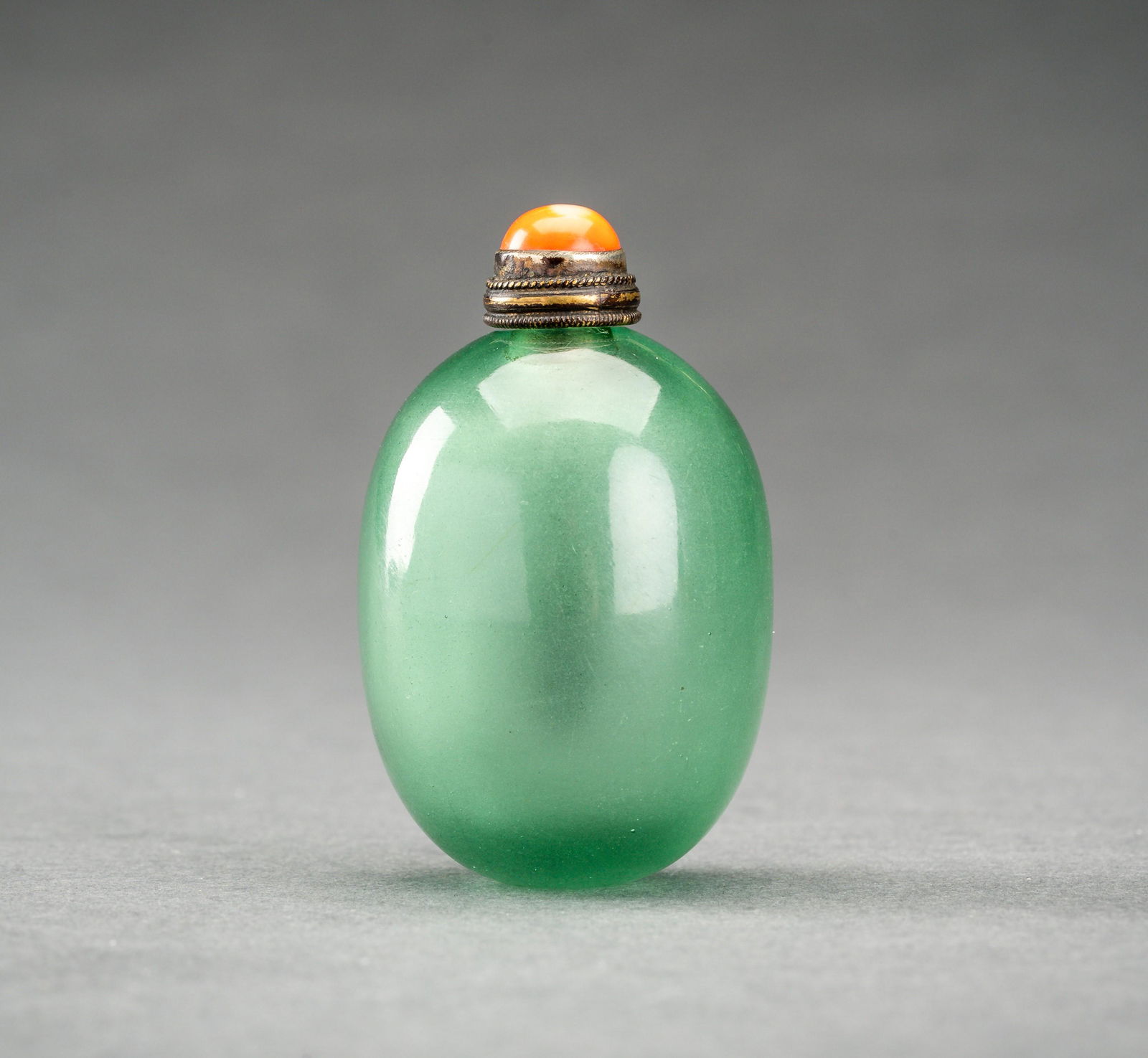 A TRANSPARENT GREEN GLASS SNUFF BOTTLE, QING DYNASTY (1 of 6)