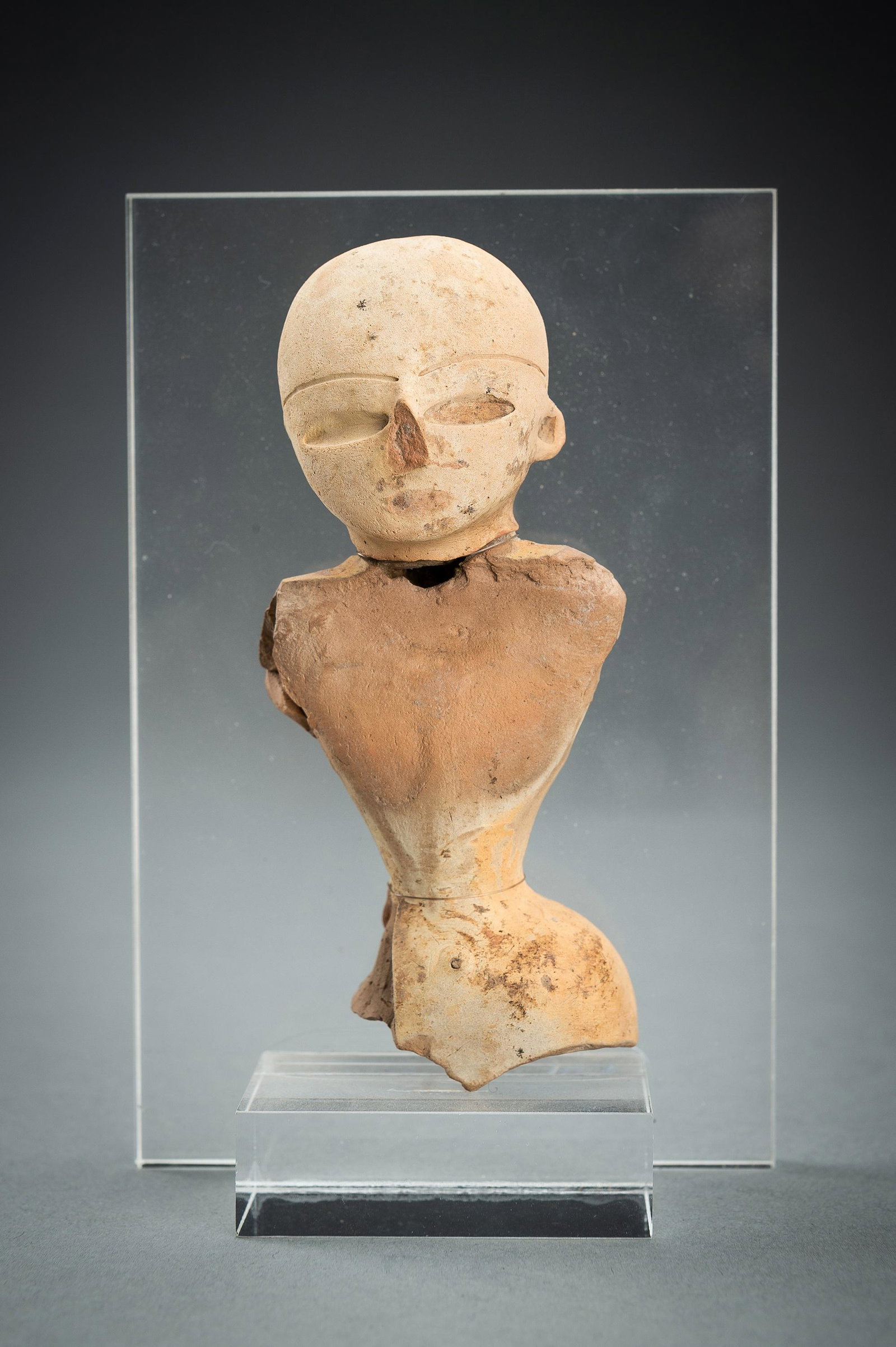 A NEOLITHIC MEHRGARH POTTERY GODDESS: A NEOLITHIC MEHRGARH POTTERY GODDESS Indus Valley, Pakistan, Mehrgarh, Neolithic period (c. 5500 BC - 4500 BC). Crafted from pale-yellow clay, depicting a female goddess with narrow hips and subtle br