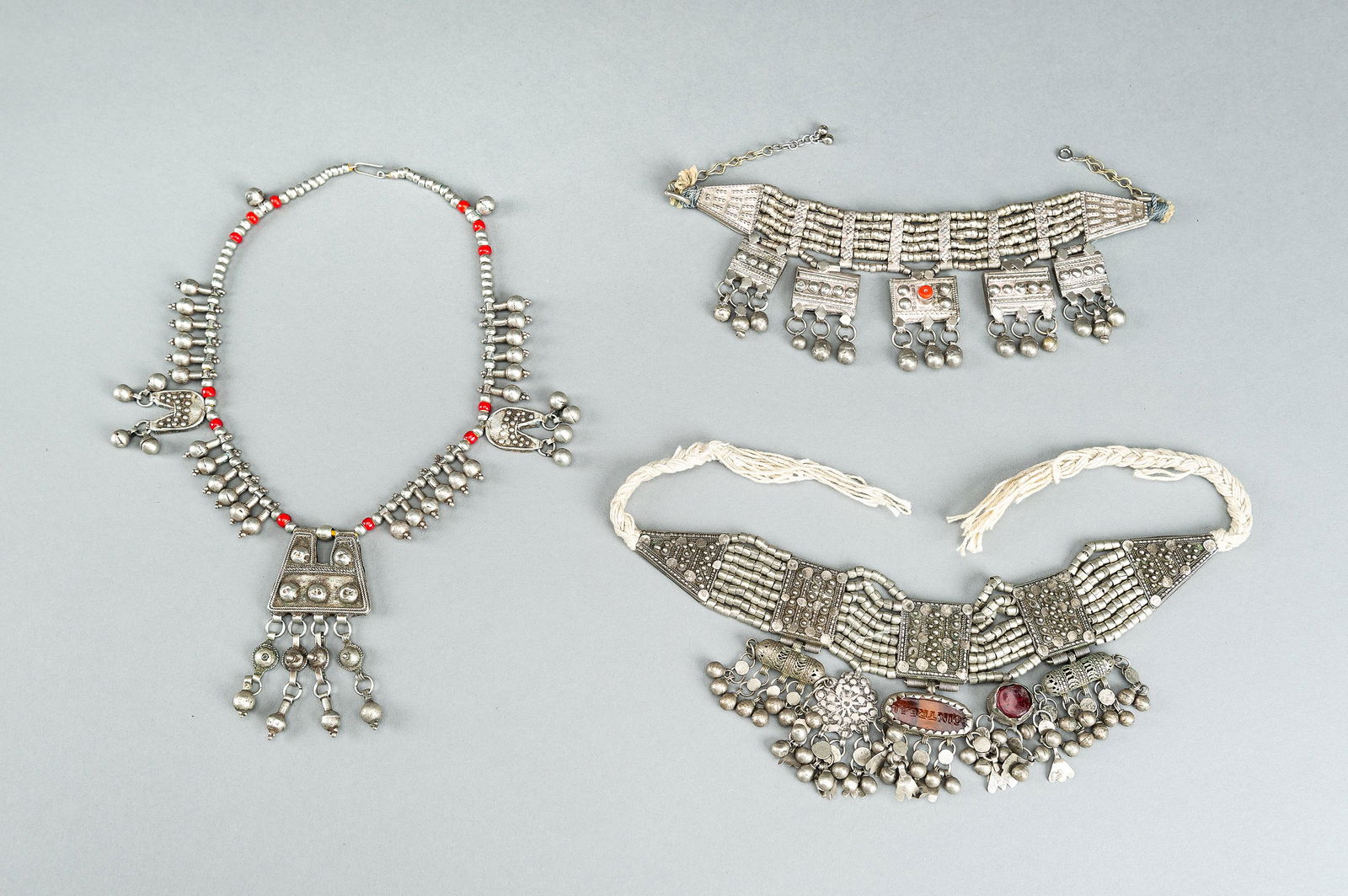 A GROUP OF THREE WHITE METAL LAZEM AMULET NECKLACES, c 1930s (1 of 16)