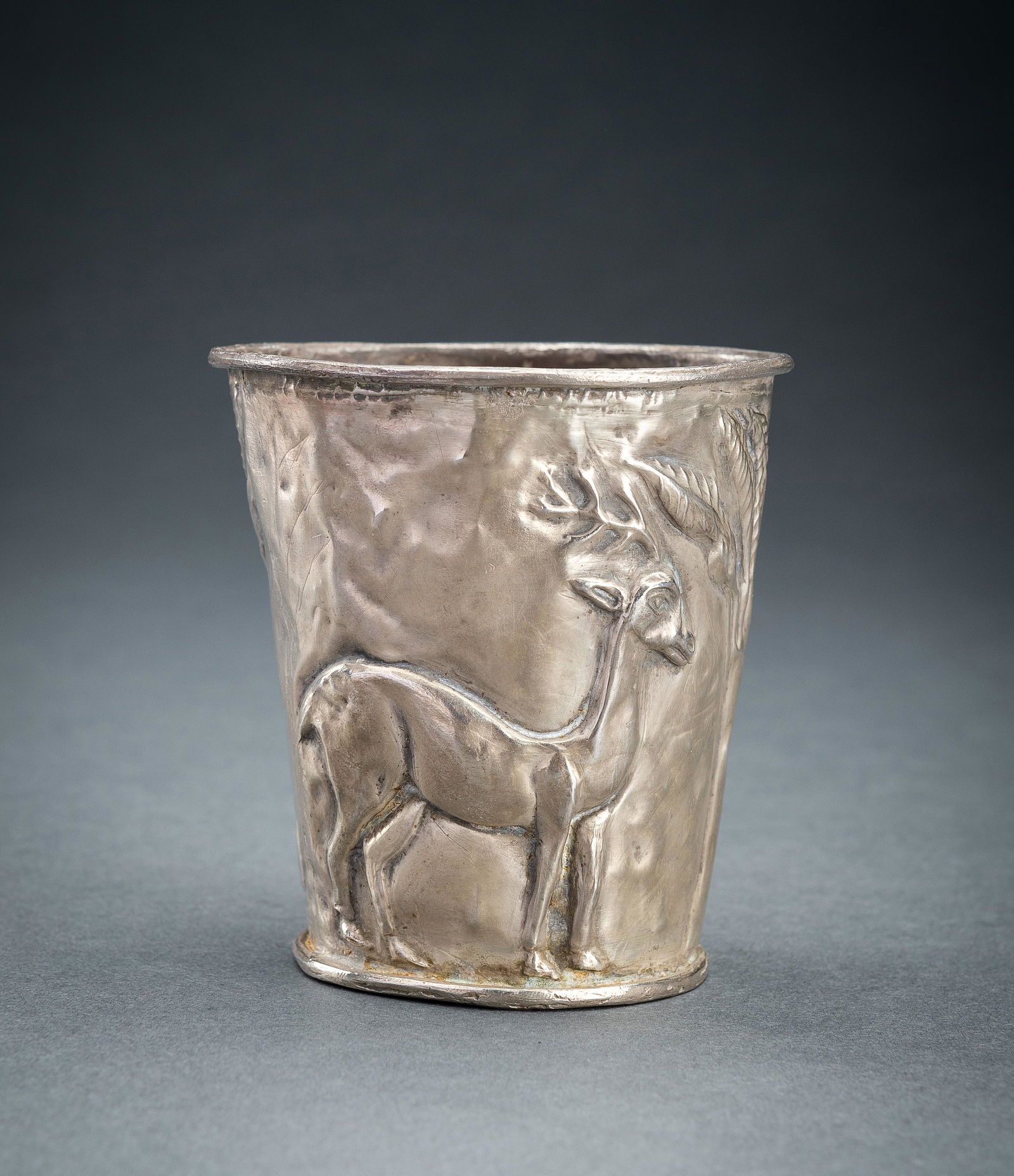 A PERSIAN SILVER REPOUSSE 'ANTELOPE' BEAKER (1 of 13)