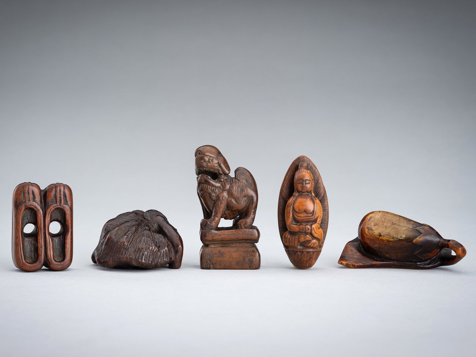 A GROUP OF FIVE WOOD NETSUKE (1 of 20)