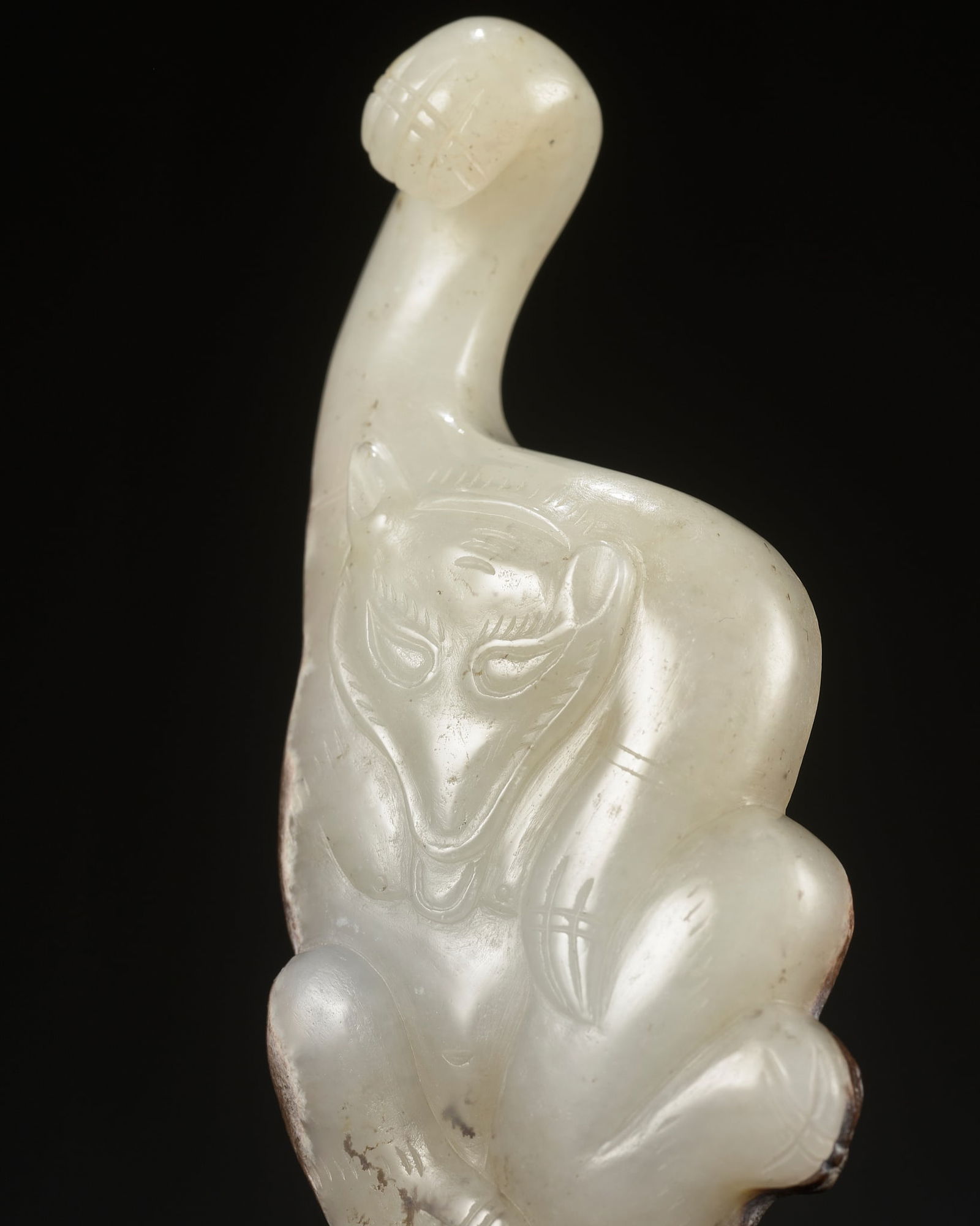AN ARCHAISTIC WHITE JADE 'BEAR' GARMENT HOOK, QING DYNASTY (1 of 8)