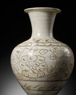 A CARVED CIZHOU SGRAFFIATO VASE, NORTHERN SONG DYNASTY: A CARVED CIZHOU SGRAFFIATO VASE, NORTHERN SONG DYNASTY 北宋磁州窯白釉剔刻花卉紋瓶 Please note this Lot is to be sold at