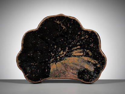 A CIZHOU RUSSET-SPLASHED BLACK-GLAZED PILLOW, SONG DYNASTY: A CIZHOU RUSSET-SPLASHED BLACK-GLAZED PILLOW, SONG DYNASTY 宋代磁州窯黑釉褐斑枕 Please note this Lot is to be sold at No Reserve.