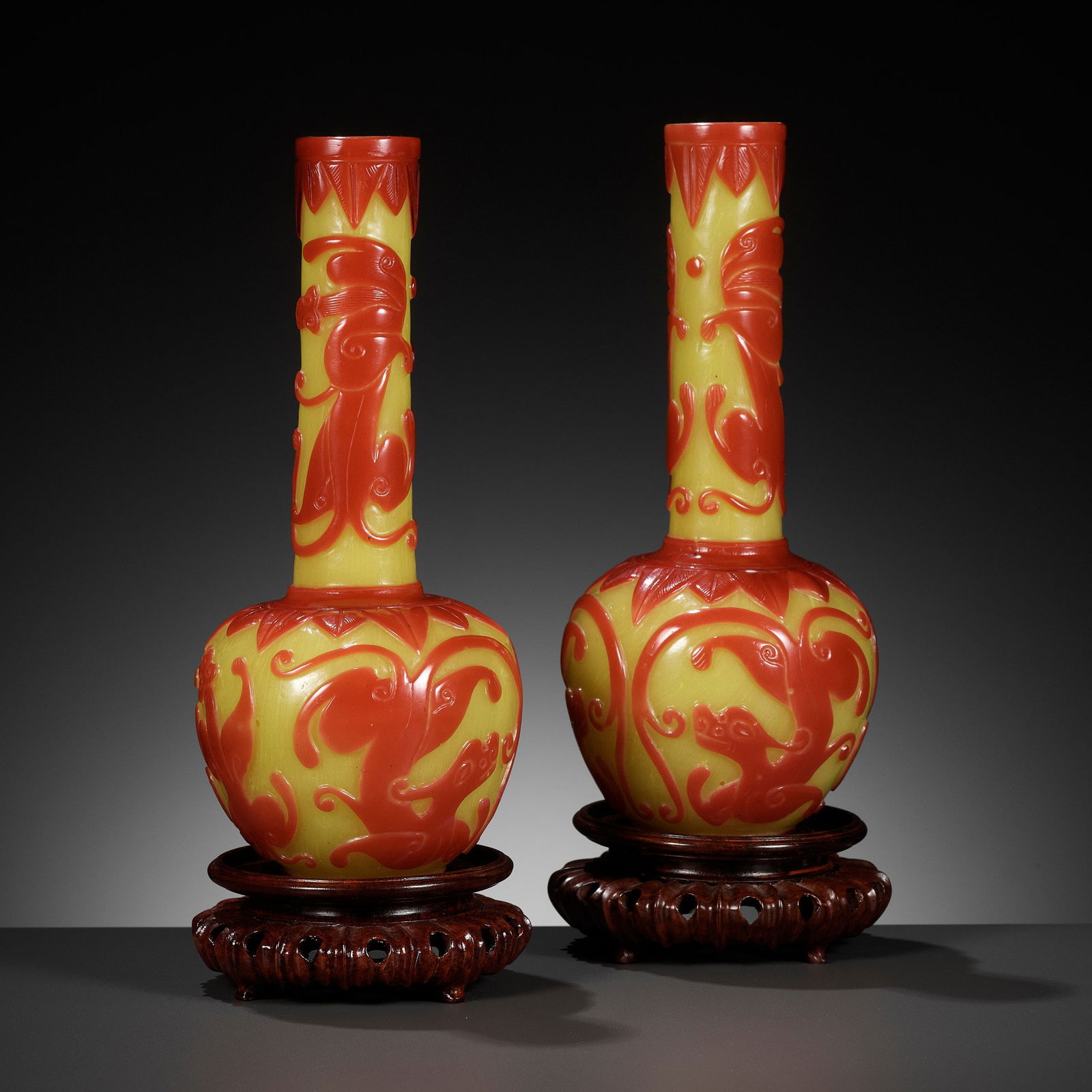 A PAIR OF CARVED RED-OVERLAY YELLOW GLASS BOTTLE VASES, 18TH-19TH CENTURY (1 of 15)