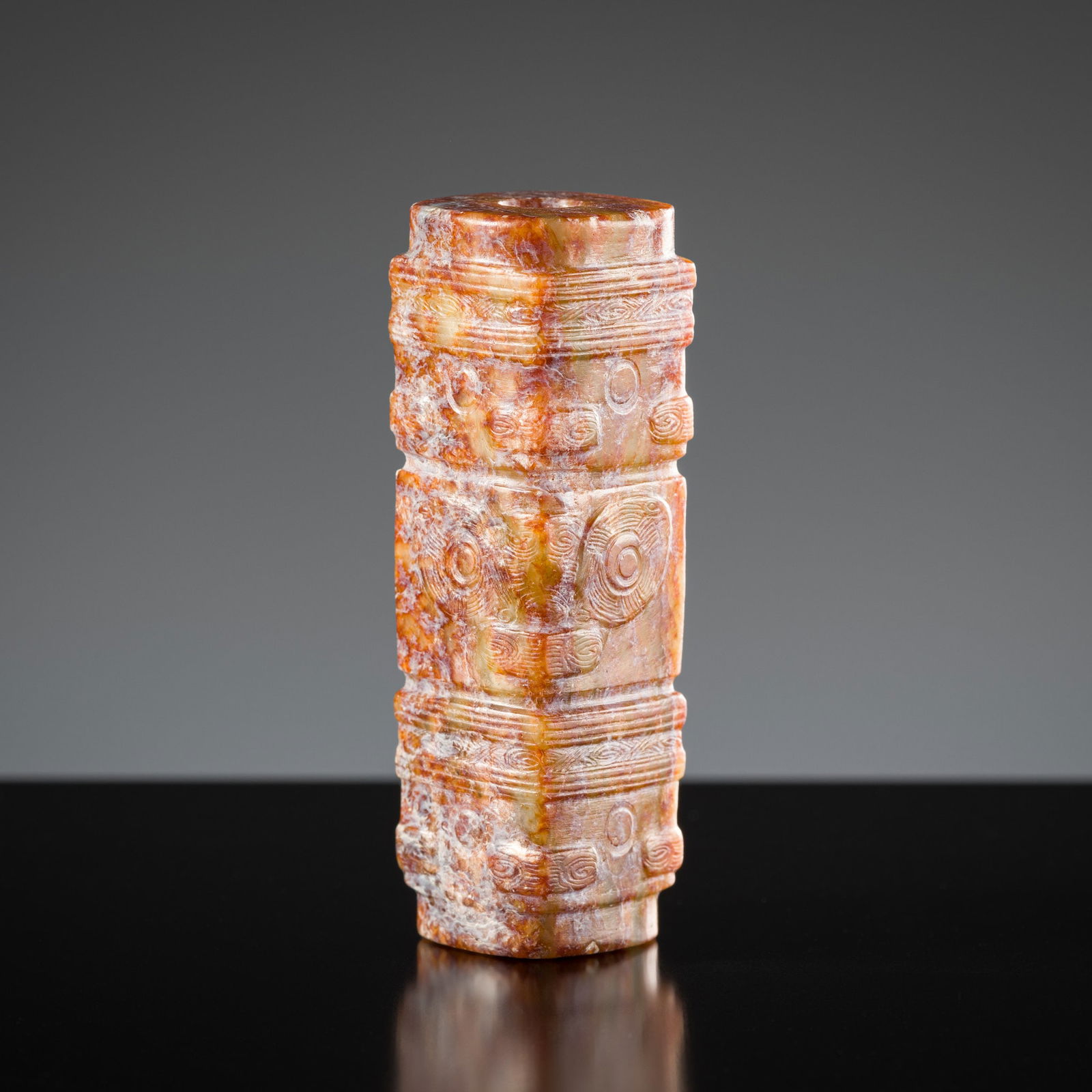 A RARE SMALL ARCHAIC CELADON JADE THREE-TIERED CONG-FORM BEAD, LIANGZHU CULTURE (1 of 10)