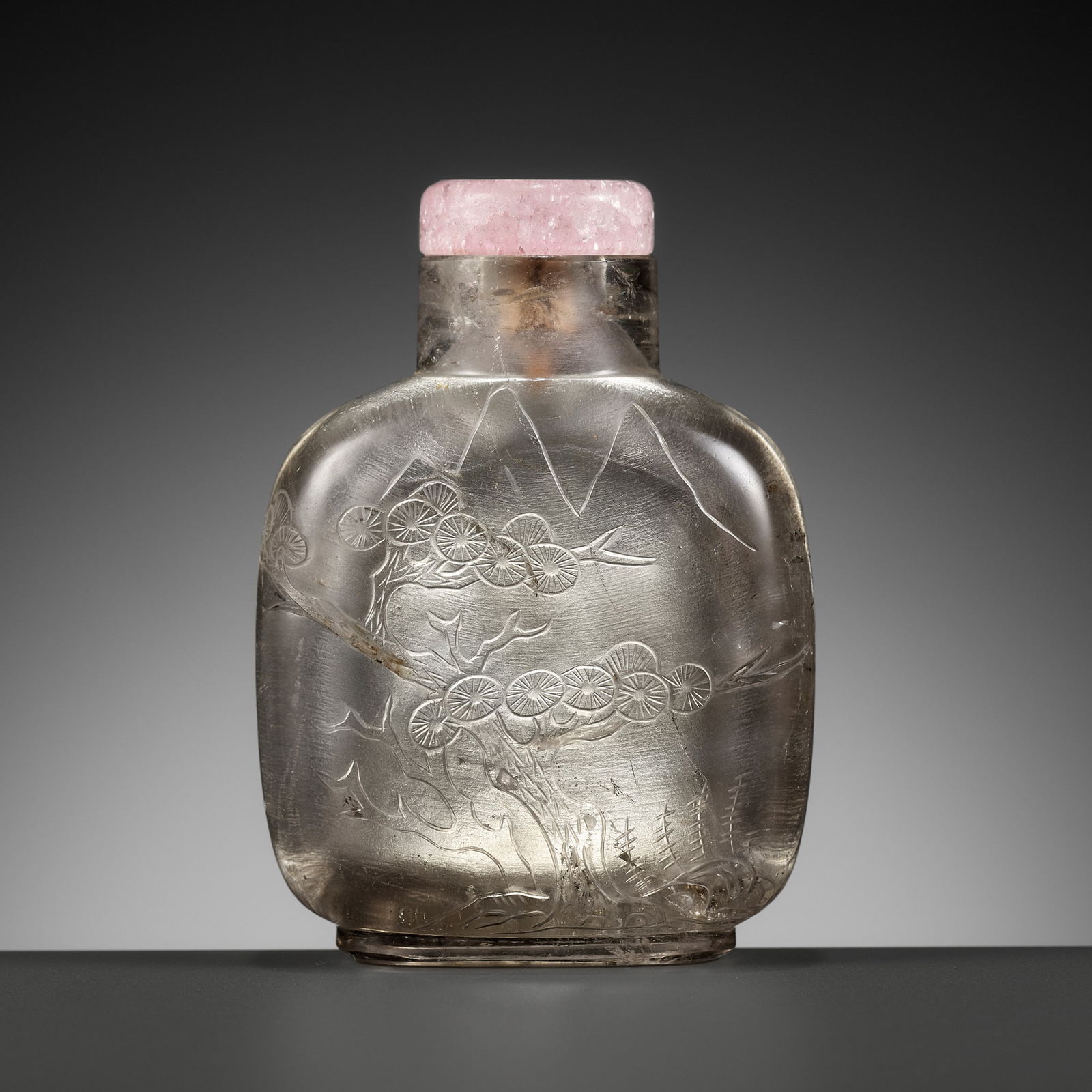 A CARVED HAIR CRYSTAL 'PINE TREE' SNUFF BOTTLE, 1750-1880 (1 of 10)