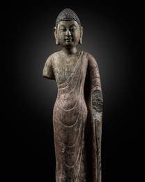 A RARE AND IMPORTANT POLYCHROME DECORATED LIMESTONE FIGURE OF BUDDHA, NORTHERN QI DYNASTY