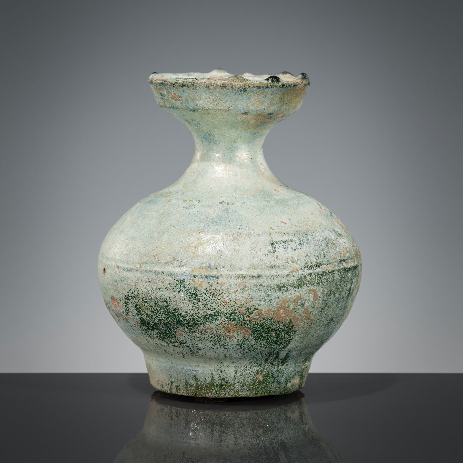 A GREEN-GLAZED POTTERY JAR, HAN DYNASTY (1 of 11)